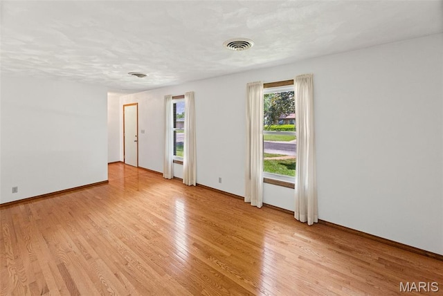 46 Coronation Dr, Millstadt, IL 62260 - unfurnished room featuring light wood finished floors and baseboards