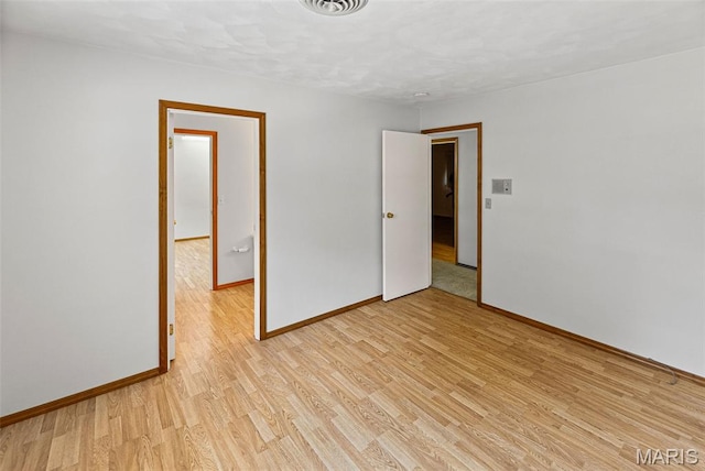 46 Coronation Dr, Millstadt, IL 62260 - unfurnished room featuring light wood finished floors and baseboards