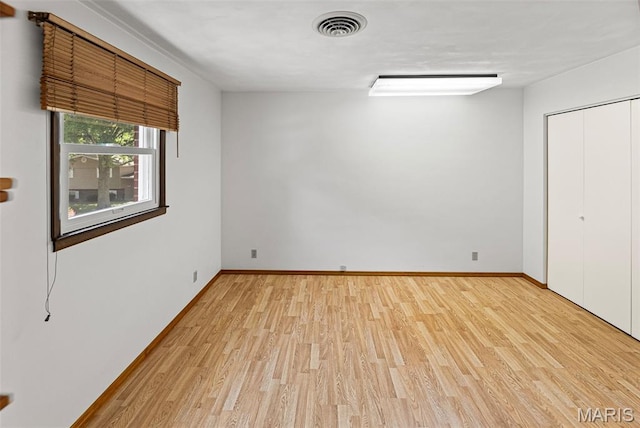 46 Coronation Dr, Millstadt, IL 62260 - unfurnished bedroom featuring light wood-type flooring and a closet