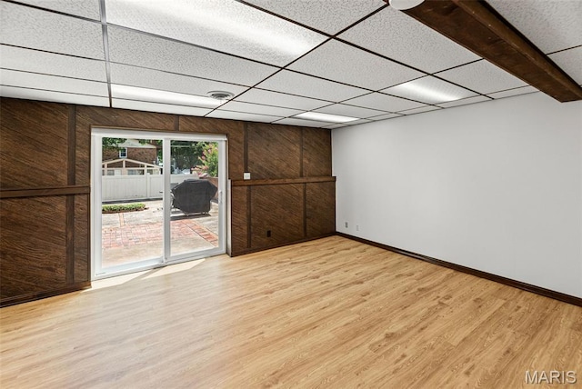 46 Coronation Dr, Millstadt, IL 62260 - spare room featuring wood finished floors, wood walls, and a paneled ceiling