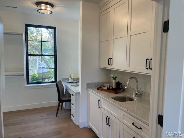 8145 University Dr, Clayton, MO 63105 - office space featuring a sink and light wood-style floors