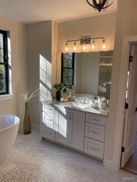 8145 University Dr, Clayton, MO 63105 - full bath with a freestanding bath, vanity, and tiled shower