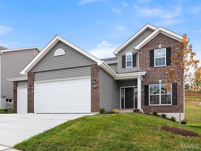 2213 Rule Ave, Maryland Heights, MO 63146 - traditional home with brick siding, an attached garage, and a front yard