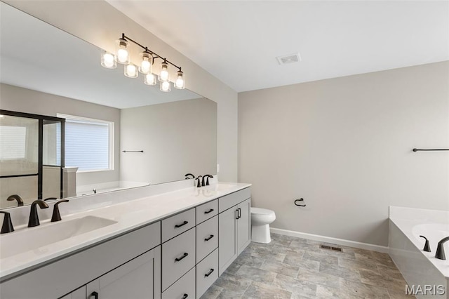 2213 Rule Ave, Maryland Heights, MO 63146 - full bathroom with a bath, double vanity, stone finish flooring, and an enclosed shower