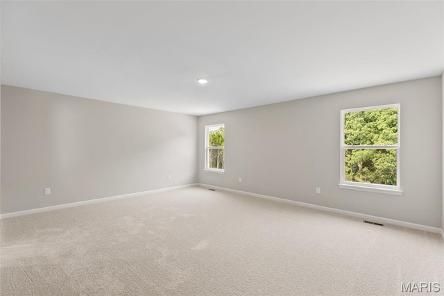 2213 Rule Ave, Maryland Heights, MO 63146 - unfurnished room featuring light carpet and recessed lighting