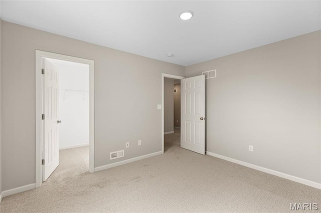 2213 Rule Ave, Maryland Heights, MO 63146 - unfurnished bedroom with carpet and a walk in closet