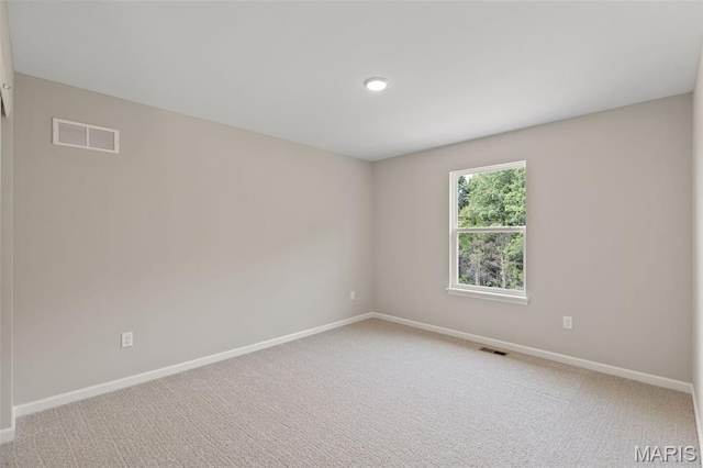 2213 Rule Ave, Maryland Heights, MO 63146 - carpeted spare room featuring baseboards