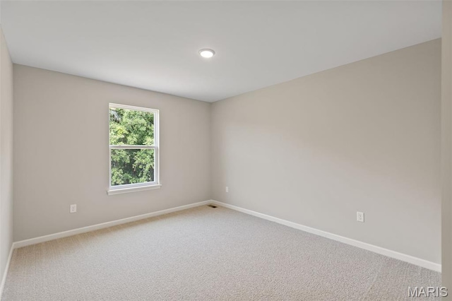 2213 Rule Ave, Maryland Heights, MO 63146 - carpeted spare room with baseboards