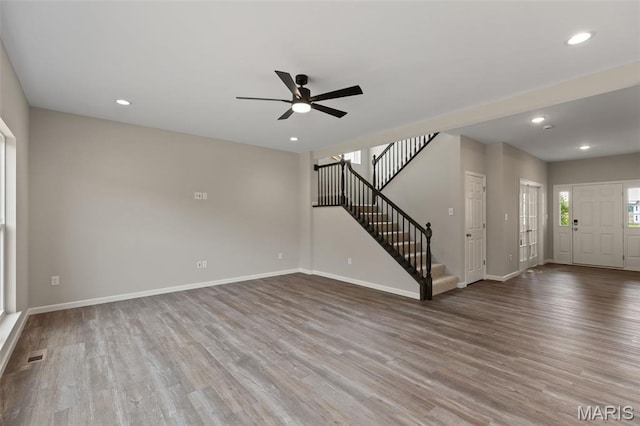 2213 Rule Ave, Maryland Heights, MO 63146 - unfurnished living room with stairway, wood finished floors, a ceiling fan, and recessed lighting