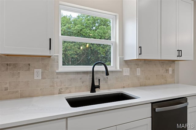 2213 Rule Ave, Maryland Heights, MO 63146 - kitchen featuring stainless steel dishwasher, white cabinetry, and decorative backsplash