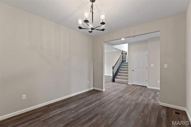 2213 Rule Ave, Maryland Heights, MO 63146 - spare room featuring a chandelier, dark wood finished floors, and stairs