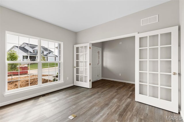 2213 Rule Ave, Maryland Heights, MO 63146 - spare room with wood finished floors and french doors