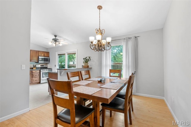 15 Ann Dr, Saint Peters, MO 63376 - dining space featuring a chandelier, light wood finished floors, and a ceiling fan