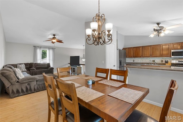 15 Ann Dr, Saint Peters, MO 63376 - dining space with a ceiling fan, light wood finished floors, and a chandelier