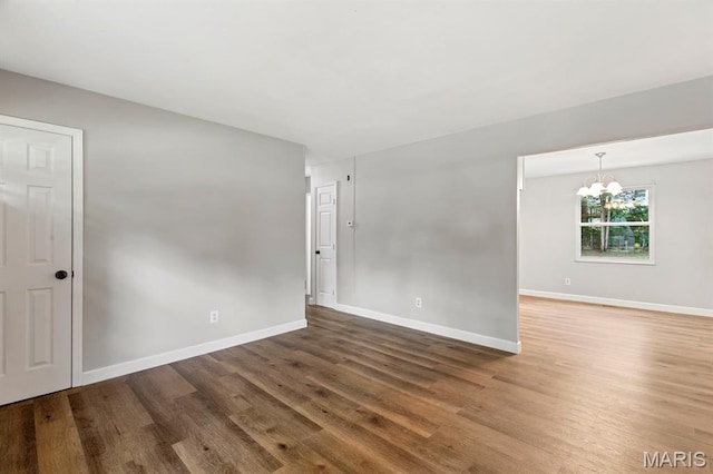 17 Edward Dr, Saint Peters Township, MO 63304 - spare room with a chandelier and wood finished floors