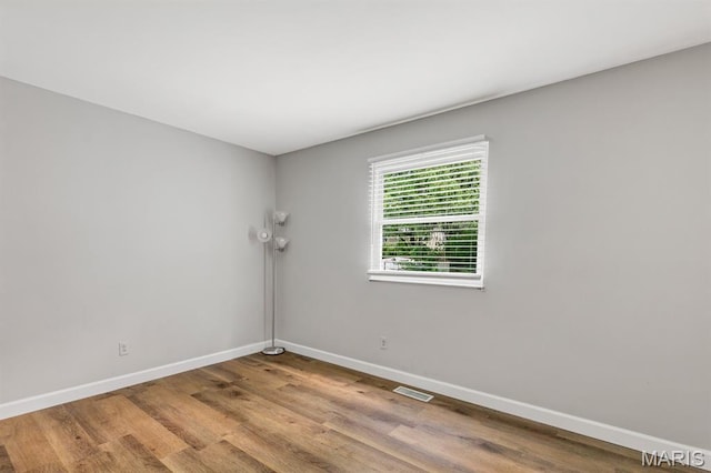 17 Edward Dr, Saint Peters Township, MO 63304 - spare room with baseboards and wood finished floors