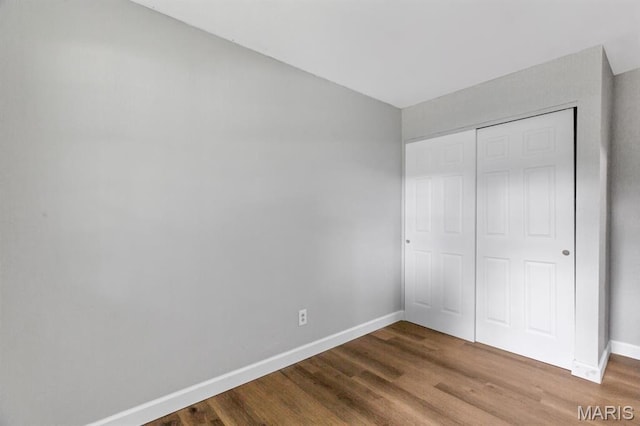 17 Edward Dr, Saint Peters Township, MO 63304 - unfurnished bedroom featuring wood finished floors and a closet