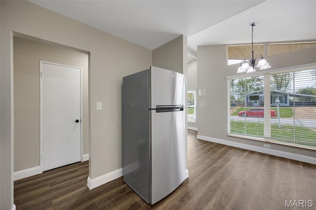 229 Orchard Ave, Ballwin, MO 63021 - kitchen with freestanding refrigerator, a chandelier, dark wood-style flooring, and pendant lighting