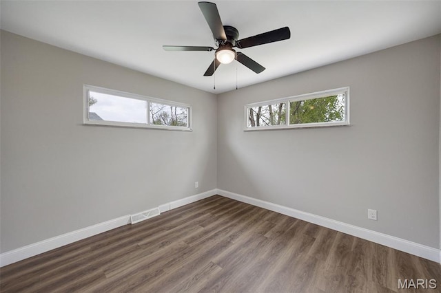 229 Orchard Ave, Ballwin, MO 63021 - empty room with dark wood-style flooring and a ceiling fan