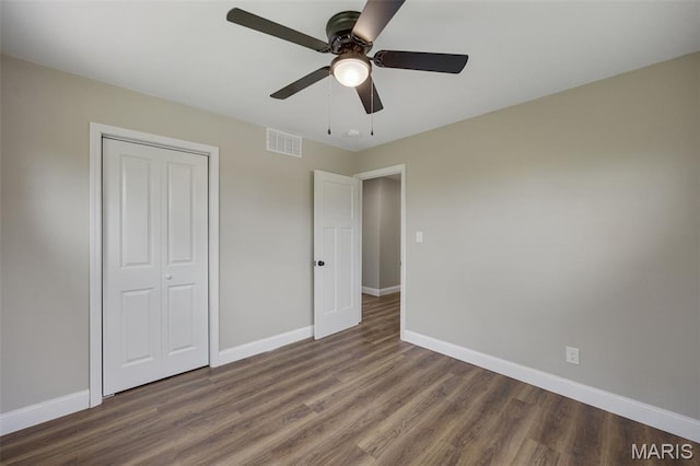 229 Orchard Ave, Ballwin, MO 63021 - unfurnished bedroom featuring wood finished floors, a closet, and ceiling fan