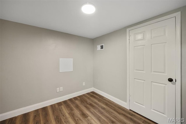 229 Orchard Ave, Ballwin, MO 63021 - empty room with baseboards and dark wood-type flooring