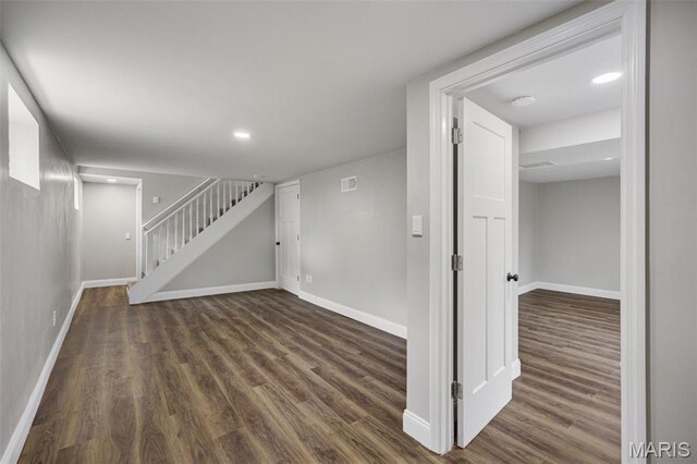 229 Orchard Ave, Ballwin, MO 63021 - finished basement featuring wood finished floors, stairway, and recessed lighting