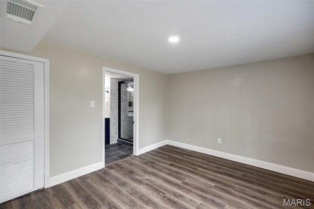 229 Orchard Ave, Ballwin, MO 63021 - unfurnished bedroom with dark wood-style floors and recessed lighting