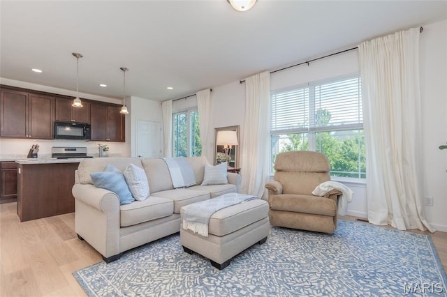 9 Vera Pl, Saint Charles, MO 63303 - living area featuring plenty of natural light, light wood-style flooring, and recessed lighting