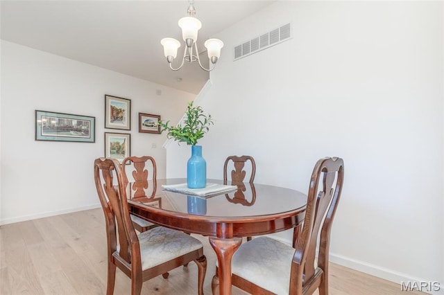 9 Vera Pl, Saint Charles, MO 63303 - dining room with a chandelier and light wood-style floors