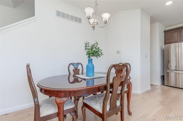 9 Vera Pl, Saint Charles, MO 63303 - dining room with a chandelier, light wood finished floors, and recessed lighting