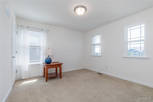 9 Vera Pl, Saint Charles, MO 63303 - spare room featuring light carpet and baseboards