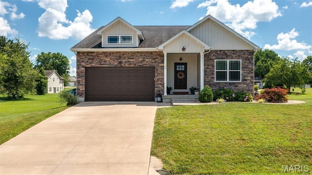 1145 Nassau Dr, Edwardsville, IL 62025 - craftsman inspired home with concrete driveway, stone siding, a front lawn, and a garage