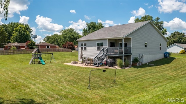 1145 Nassau Dr, Edwardsville, IL 62025 - back of property with stairs, a wooden deck, and a patio