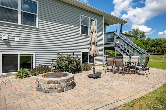 1145 Nassau Dr, Edwardsville, IL 62025 - view of patio / terrace featuring a fire pit, stairs, outdoor dining area, and a deck