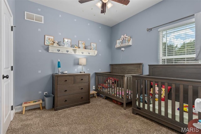 1145 Nassau Dr, Edwardsville, IL 62025 - bedroom featuring carpet floors, a nursery area, and a ceiling fan