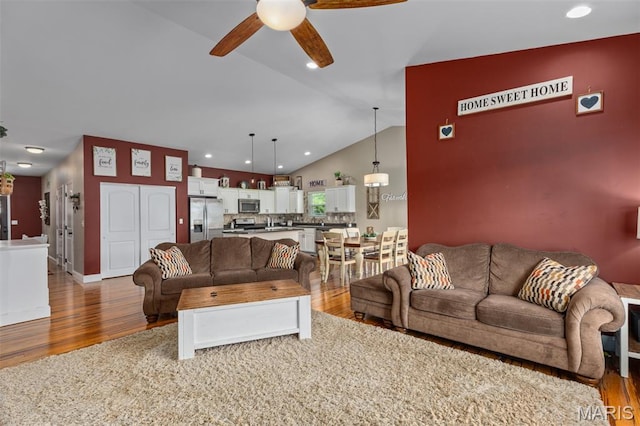 1145 Nassau Dr, Edwardsville, IL 62025 - living room featuring wood finished floors, a ceiling fan, lofted ceiling, and recessed lighting