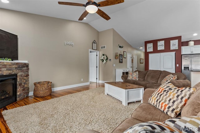 1145 Nassau Dr, Edwardsville, IL 62025 - living room featuring a ceiling fan, light wood finished floors, a stone fireplace, recessed lighting, and high vaulted ceiling