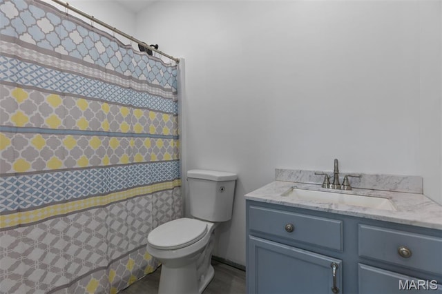 1145 Nassau Dr, Edwardsville, IL 62025 - full bath with vanity, a shower with shower curtain, and wood finished floors