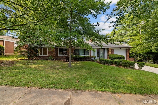 7315 Ahern Ave, University City, MO 63130 - ranch-style home with a garage, brick siding, a front lawn, and driveway
