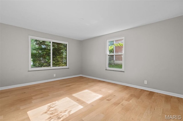 7315 Ahern Ave, University City, MO 63130 - unfurnished room with light wood-type flooring and baseboards