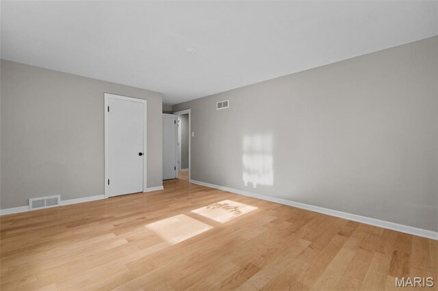 7315 Ahern Ave, University City, MO 63130 - empty room featuring light wood-type flooring