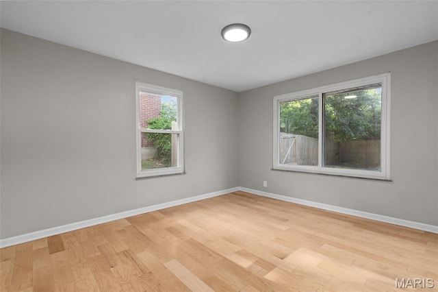 7315 Ahern Ave, University City, MO 63130 - unfurnished room with light wood finished floors