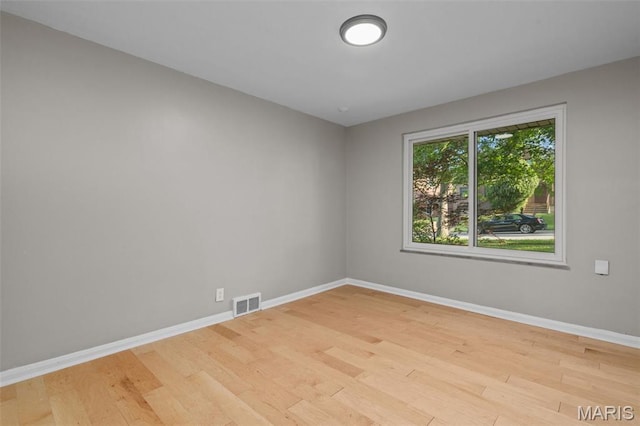 7315 Ahern Ave, University City, MO 63130 - spare room featuring baseboards and wood finished floors