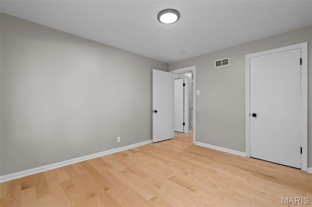 7315 Ahern Ave, University City, MO 63130 - unfurnished bedroom featuring light wood-style floors