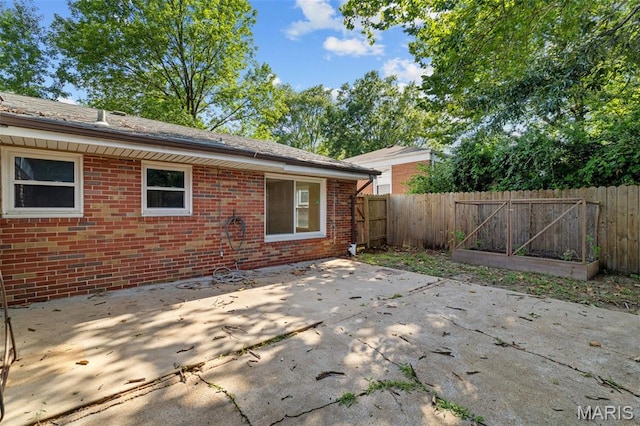 7315 Ahern Ave, University City, MO 63130 - fenced backyard featuring a patio