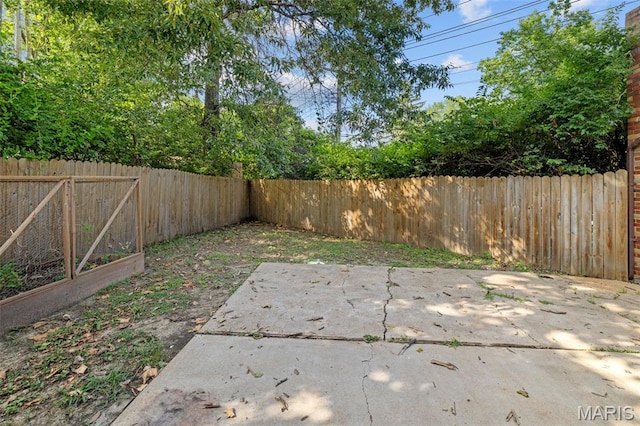 7315 Ahern Ave, University City, MO 63130 - fenced backyard with a patio area