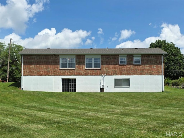 320 W 6th St, Washington, MO 63090 - back of house featuring brick siding and a lawn
