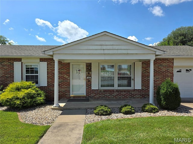 320 W 6th St, Washington, MO 63090 - single story home featuring brick siding, a porch, an attached garage, and a shingled roof