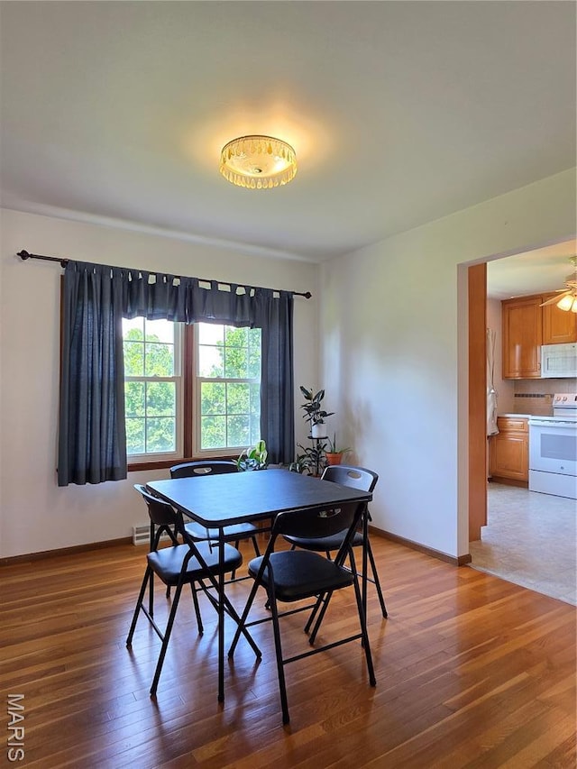 320 W 6th St, Washington, MO 63090 - dining space with wood finished floors