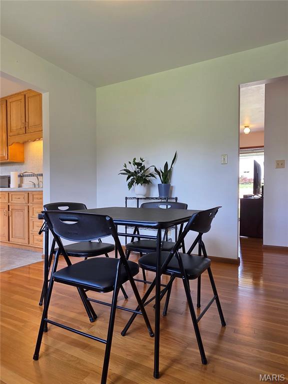 320 W 6th St, Washington, MO 63090 - dining space featuring light wood-type flooring